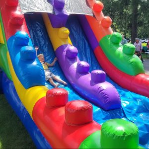 boy on inflatable slide